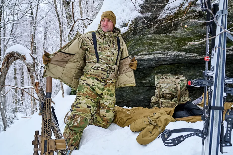 Soldier with his gear in the snow