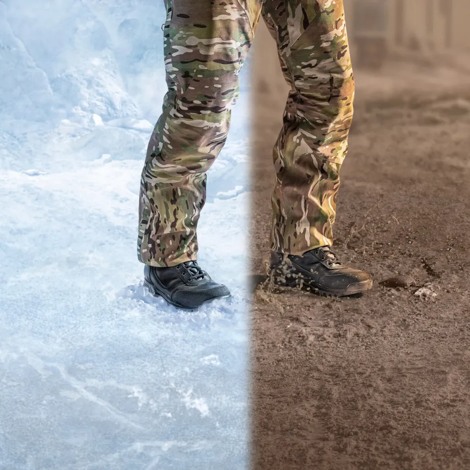 Soldier's legs standing split over a frozen climate and desert climate