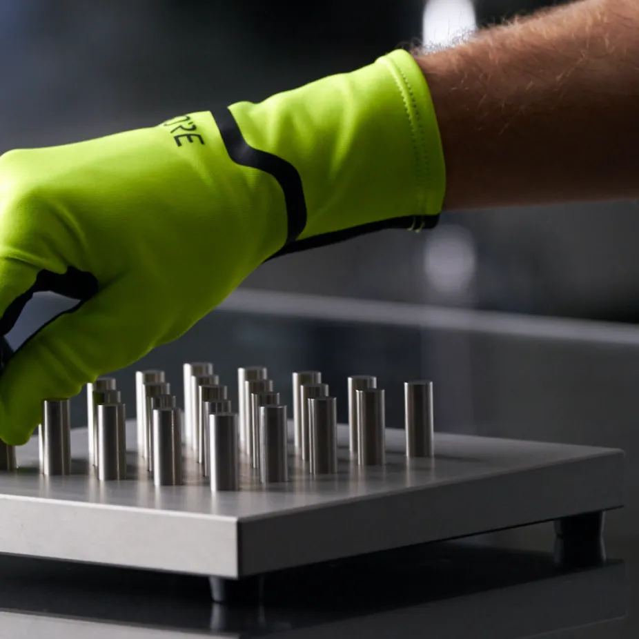 a close up shot of a hand wearing a Gore glove in a testing lab